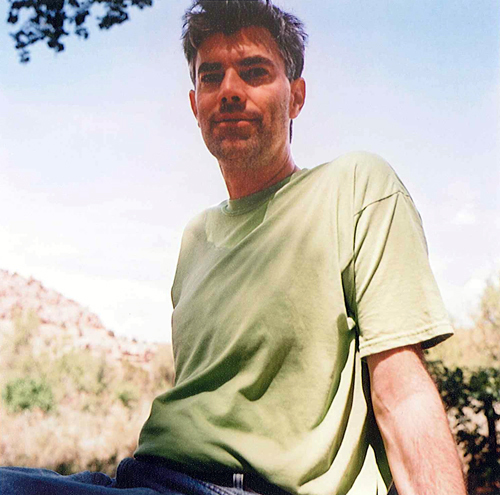 John Simmons in a green t-shirt