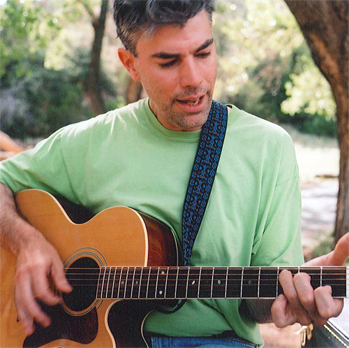 John Simmons in a green t-shirt