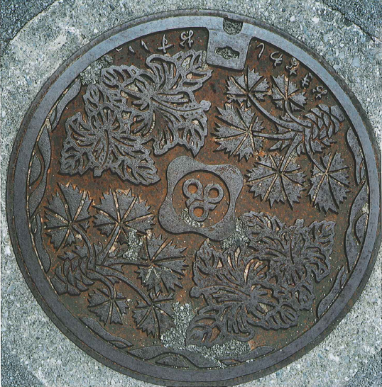 Manhole cover with plants