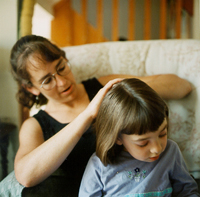 Sharon fixing Kaya's hair