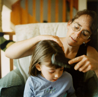 Sharon fixing Kaya's hair